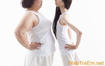 asian women facing each other with hands on hips a
